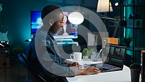 Remotely working videographer doing video montage using specialized software