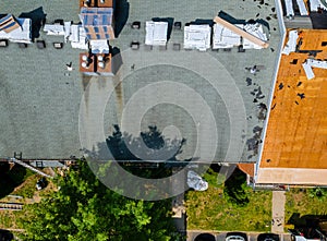 Removal of old roof and replacement with new roof shingle being applied home roof construction site all new materials