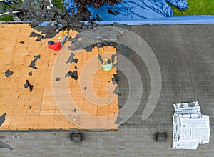 Removal old roof replacement with new shingles of an apartment building