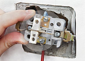 Removal and replacement of the old, faulty wall switch light.