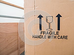 A removal van and cardboard box close-up. Copy space.