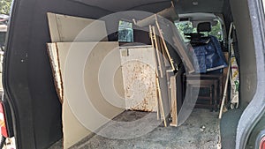 A removals van being packed with old furniture photo