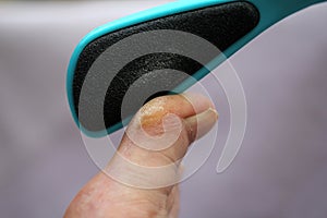 With the file on the toe