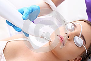 Removing acne scars by laser.