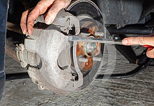 Removing caliper while replacing car brakes