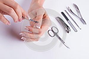 Removing cuticle. Manicure set.