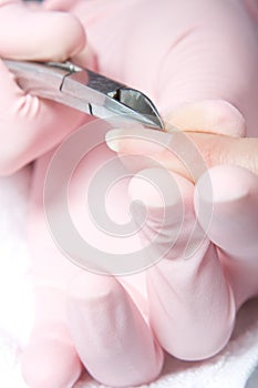 Removing cuticle from the nail photo