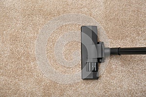Removing dirt from carpet with vacuum cleaner, top view. Space for text