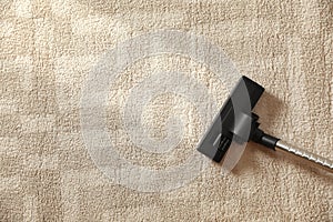 Removing dirt from light carpet with vacuum cleaner