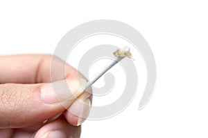 Removing ear wax using a cotton bud