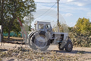 Removing fallen tree with tractor and loader