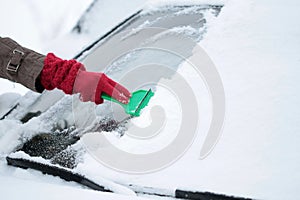 Removing ice and snow from windshield