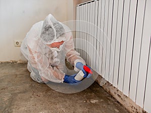 Removing Mold From Internal Walls. Elimination of mold at home under the heating battery.