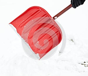 Removing snow with a shovel