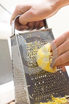 Removing the zest from the lemon. an ingredient for delicious dishes