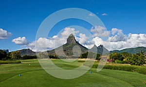 Rempart Mountain overlooking the 2nd Tee of Tamarin Bay Golf Course in Mauritius.