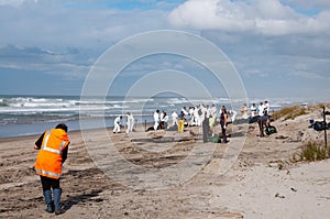 Rena oil spill clean up workers