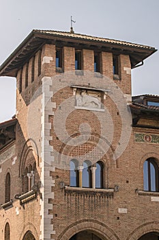 Renaissance brick tower with triple lancet window in Italy