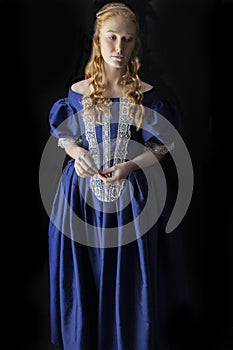 Renaissance century woman in a blue  silk gown