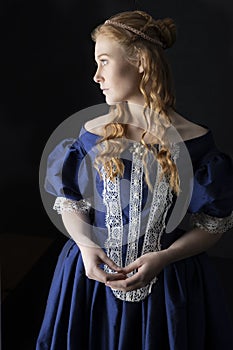 Renaissance century woman in a blue  silk gown