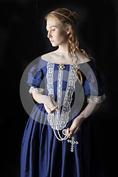 Renaissance century woman in a blue  silk gown