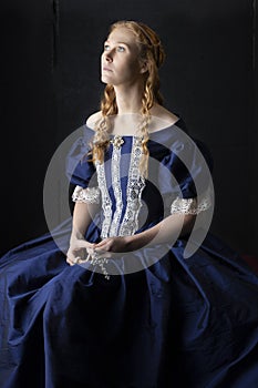 Renaissance century woman in a blue  silk gown