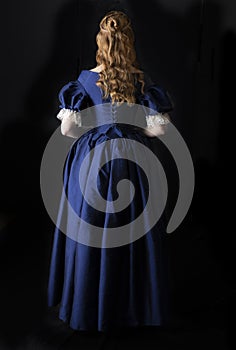 Renaissance century woman in a blue  silk gown