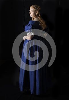 Renaissance century woman in a blue  silk gown