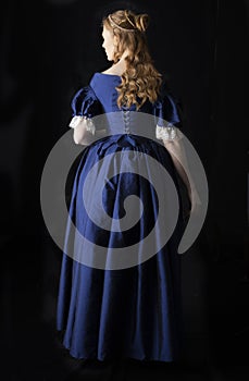 Renaissance century woman in a blue  silk gown