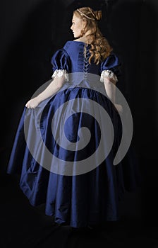 Renaissance century woman in a blue  silk gown