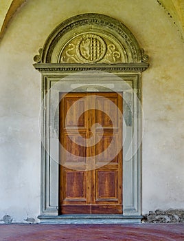 Renaissance door in the cloister of Basilica di Santa Croce. Florence, Italy