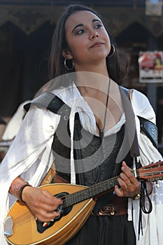 Musicians dressed in Medieval costumes at a renaissance faire