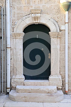 Renaissance front door with marble frame