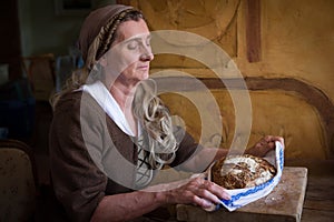 Renaissance woman holding bread