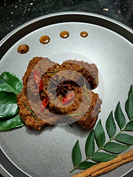 Rendang is beef slow cooked with coconut milk and hundred of spice and herb from Indonesia