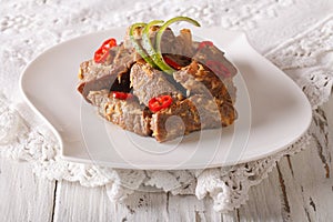 Rendang beef with spices close-up on the table. horizontal