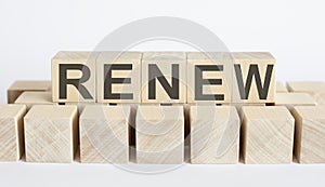 RENEW word from wooden blocks on desk, search engine optimization concept