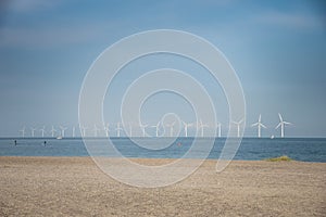 Renewable electricity production in offshore wind farm off Amager Strand in the Oresund Strait, Baltic Sea. Copenhagen, Denmark