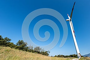 Renewable energy - Wind turbine above the hill