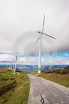 Renewable energy. Wind turbines, eolic park in scenic landscape of basque country, Spain.