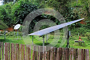 Renewable solar energy and telecommunications in a village of East Asia, in jungle