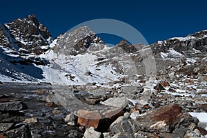 Renjo pass: mountain peaks and stream in Himalayas