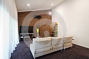 Renovated 70s exposed brick wall apartment living room