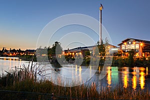 Renovated Buildings alongside a River at Twilight