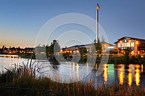 Renovated Buildings alongside a River at Twilight photo