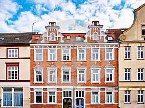 Renovated old house with ornate dormer windows and a beautiful facade in the old town of Wismar. Germany