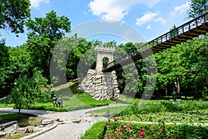 Renovated suspended metallic bridge in Nicolae Romaescu park from Craiova in Dolj county, Romania, in a beautiful sunny spring day