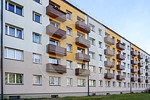 Renovated and thermally insulated facade of a typical 1970s apartment building with balconies