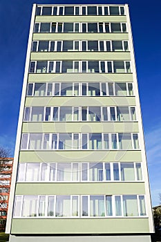 Renovated and thermally insulated facade of a typical 1970s apartment building, cheap city quarter