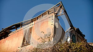 renovating incentive for crumbled buildings with roof gutter house background